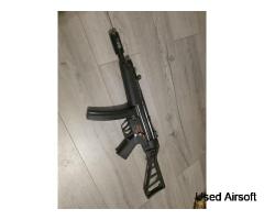 WE Apache SMG GBBR MP5 with folding UMP stock.