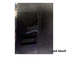 We GBB pistol + 2 mags