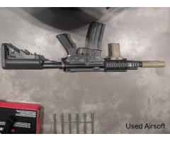 Classic Army M4 carbine with accessories and mags.