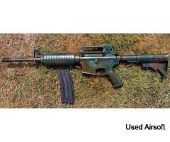 SRC M4.  Great starter gun. Rattle snake camo sprayed. Hits silhouette @60 yards/0.2 g BBs