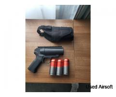 Grenade launcher pistol with 3 shells