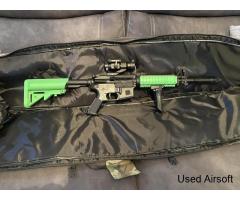 Two tone m4 style airsoft rifle.