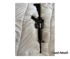 M4-style AEG (Automatic Electric Gun) airsoft rifle