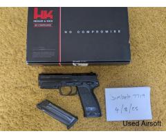 Umarex KWA USP 45 with front light attachment and spare mag.