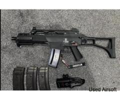 WE G36 with 1 original High cap magazine and 2 brand new mid cap mags