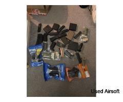 Bargain box of magazines, holsters and grips and four grips