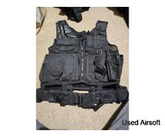 Light weight black tactical vest with belt attached